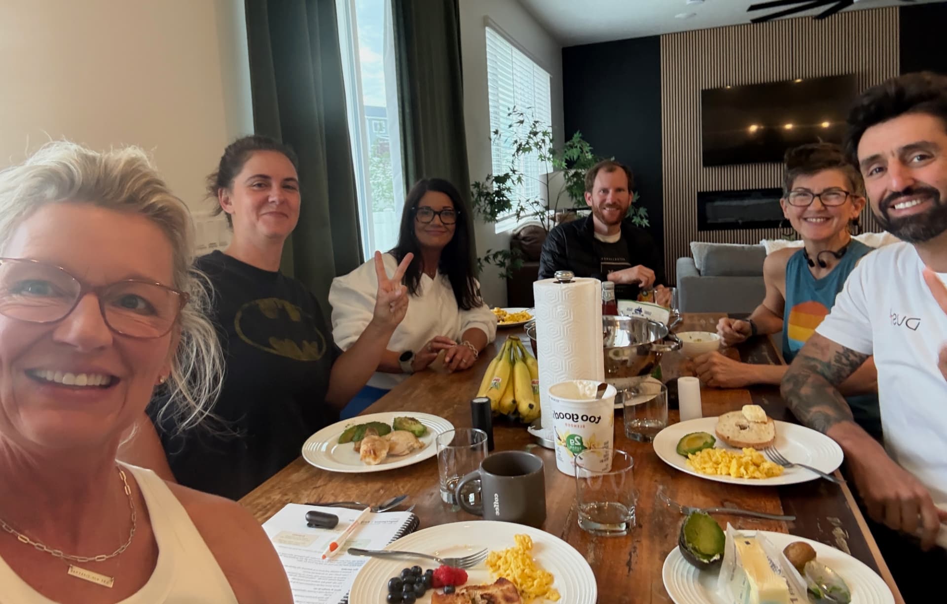Participants gathered around the kitchen table over breakfast